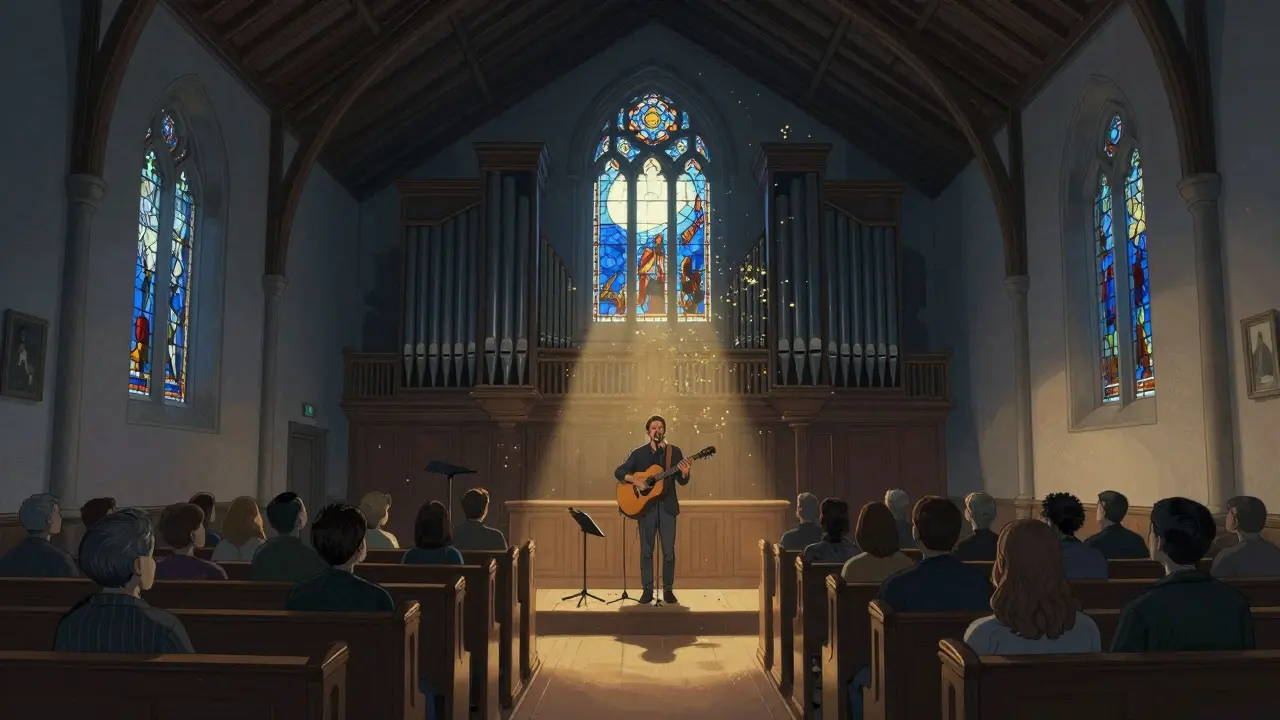 Silent audience in Union Chapel bathed in stained glass light during an intimate acoustic performance.
